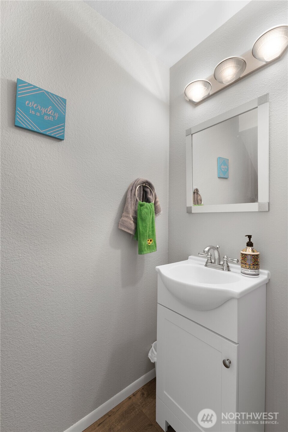 701 5th Avenue South, Unit C105 Kent, WA 98032 - Photo 13 of 31 a bathroom with a sink mirror vanity and toilet