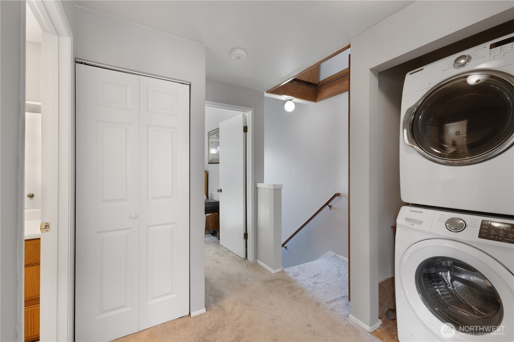 701 5th Avenue South, Unit C105 Kent, WA 98032 - Photo 15 of 31 a view of a hallway with washer and dryer