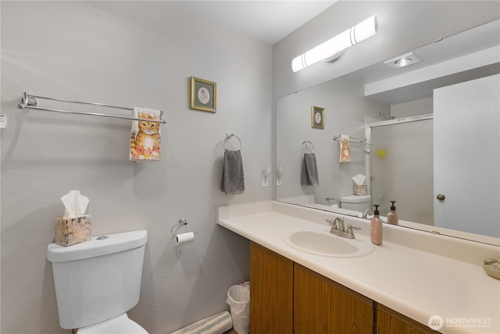 701 5th Avenue South, Unit C105 Kent, WA 98032 - Photo 18 of 31 a bathroom with a sink toilet and mirror