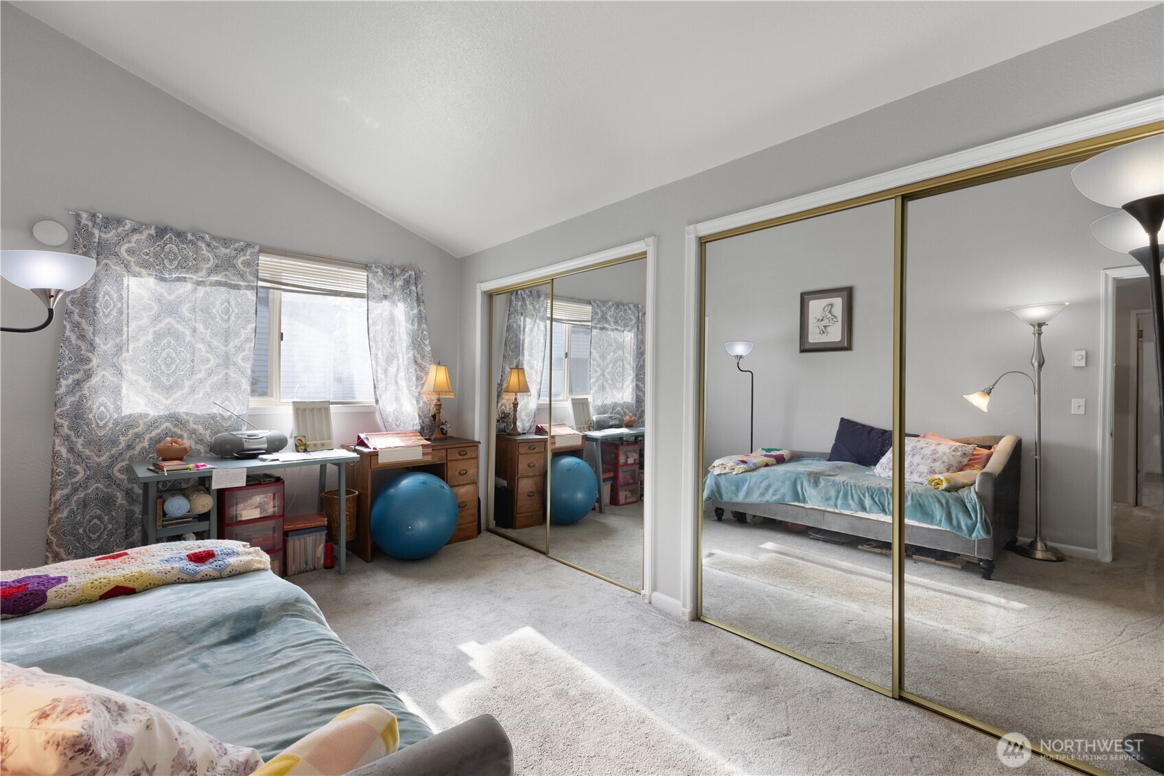 701 5th Avenue South, Unit C105 Kent, WA 98032 - Photo 20 of 31 a bedroom with furniture and a balcony