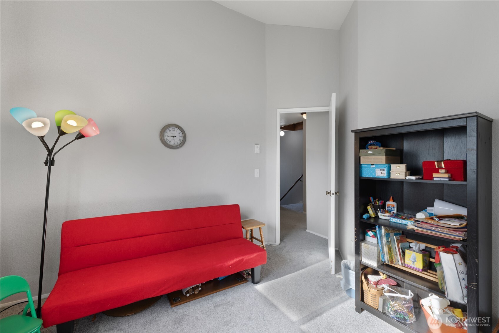 701 5th Avenue South, Unit C105 Kent, WA 98032 - Photo 23 of 31 a living room with furniture and a book shelf