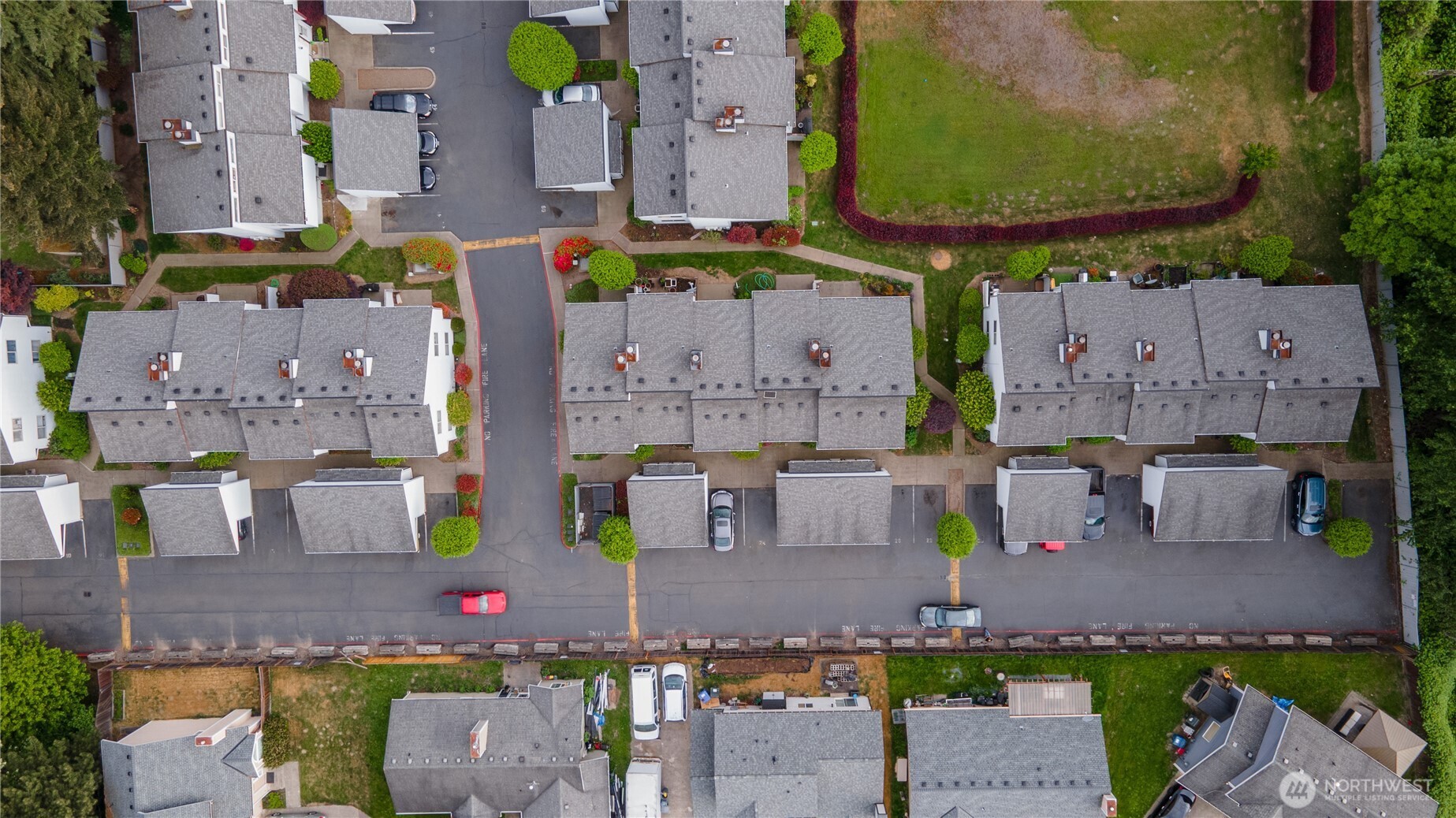 701 5th Avenue South, Unit C105 Kent, WA 98032 - Photo 29 of 31 an aerial view of multiple house with a swimming pool