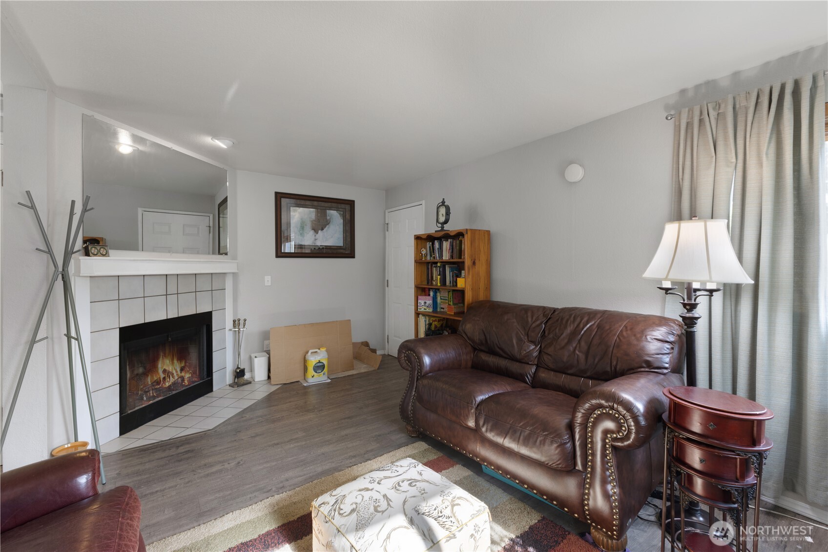 701 5th Avenue South, Unit C105 Kent, WA 98032 - Photo 6 of 31 a living room with furniture and a fireplace