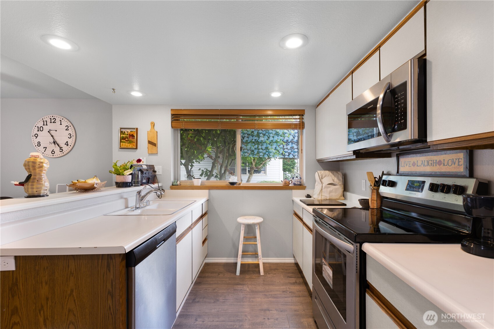 701 5th Avenue South, Unit C105 Kent, WA 98032 - Photo 10 of 31 a kitchen with stainless steel appliances a sink stove and cabinets