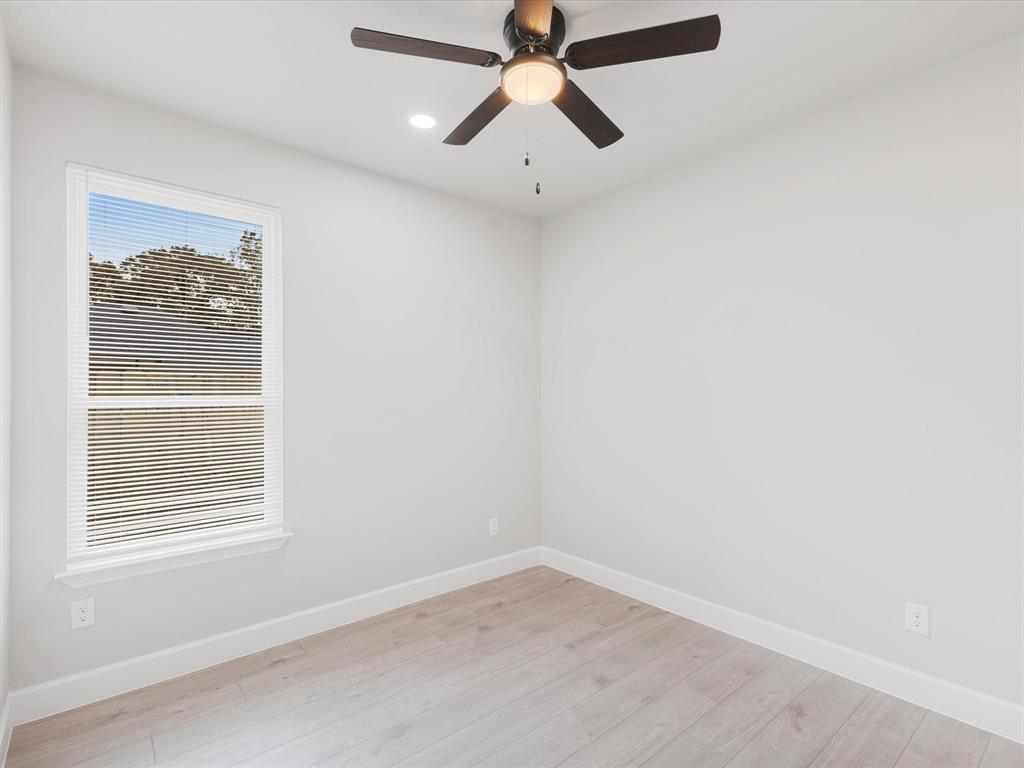 6126 Inca Drive Mabank, TX 75156 - Photo 16 of 31 an empty room with a window and a fan