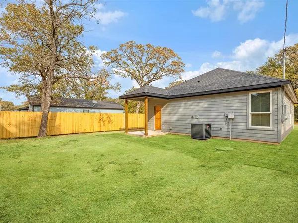 a view of a house with pool and a yard