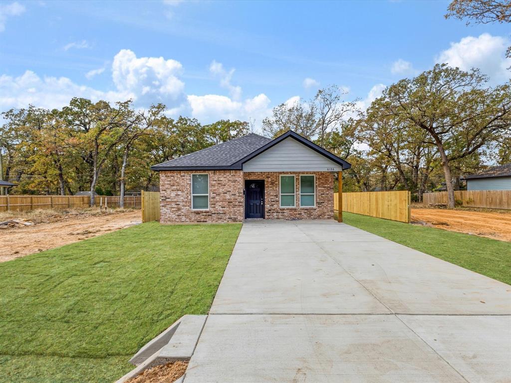 6126 Inca Drive Mabank, TX 75156 - Photo 5 of 31 a front view of a house with garden