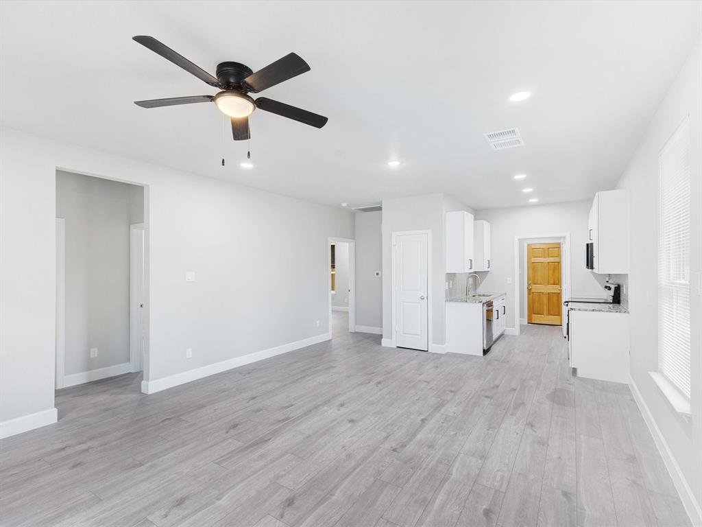 6126 Inca Drive Mabank, TX 75156 - Photo 9 of 31 a view of a livingroom with a ceiling fan wooden floor and a ceiling fan
