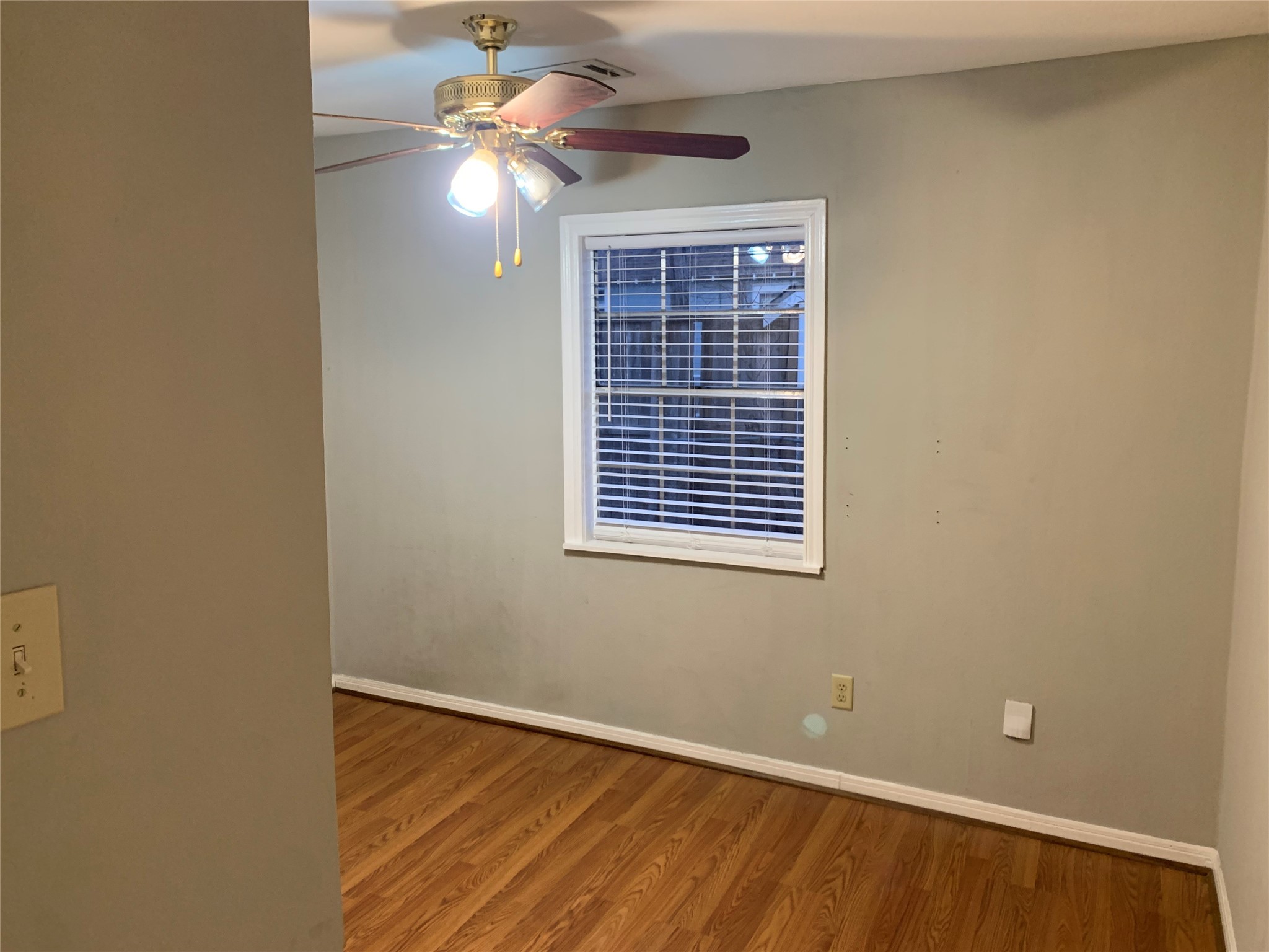 215 East 25th Street Houston, TX 77008 - Photo 12 of 18 a view of an empty room with window and chandelier fan