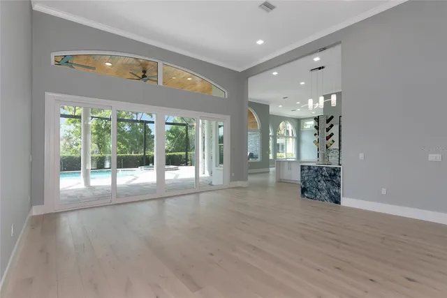 a kitchen with kitchen island granite countertop white cabinets white stainless steel appliances and a sink