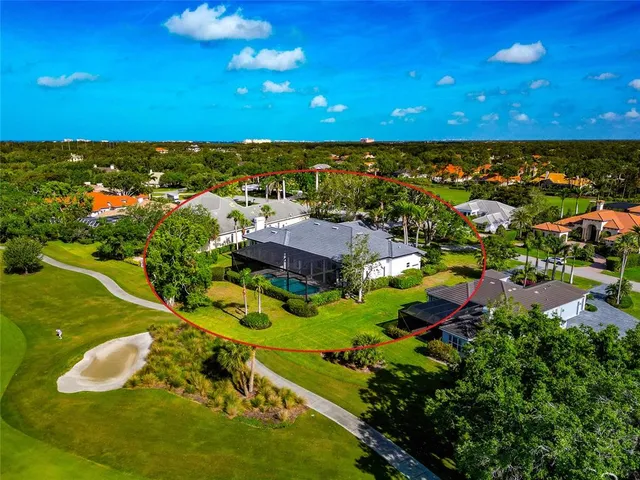 a view of a backyard with a swimming pool