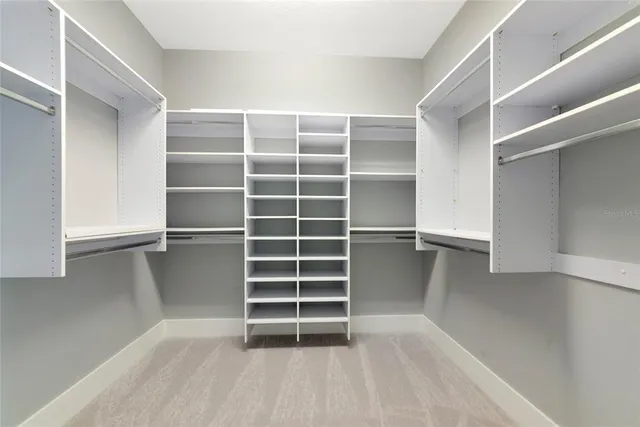 a kitchen with white cabinets and a sink