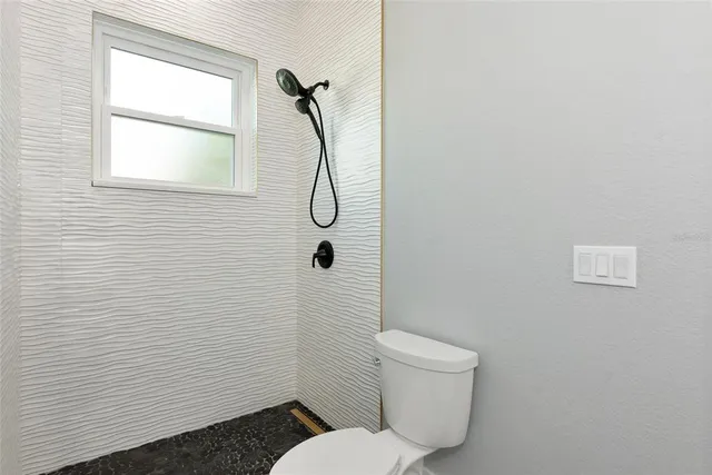 a view of a back yard of the house and green space