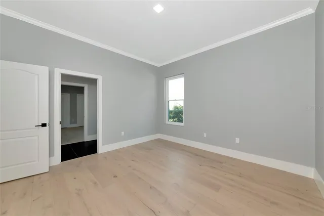 a view of a hallway with a black and white checkered floor