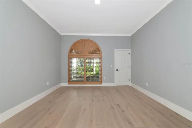 a view of a living room with furniture and garden view