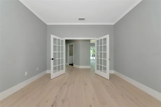 a view of a dining room with furniture and a chandelier