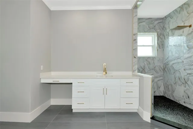 a dining room with furniture a rug and a chandelier
