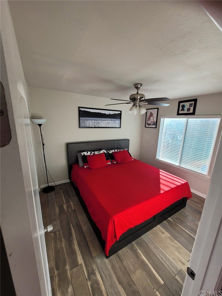 42901 Alexo Drive Lancaster, CA 93536 - Photo 11 of 20 a bed sitting in a bedroom next to a larger window
