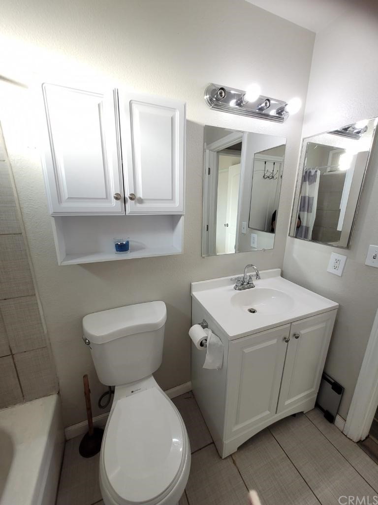 42901 Alexo Drive Lancaster, CA 93536 - Photo 14 of 20 a bathroom with a sink a toilet and mirror