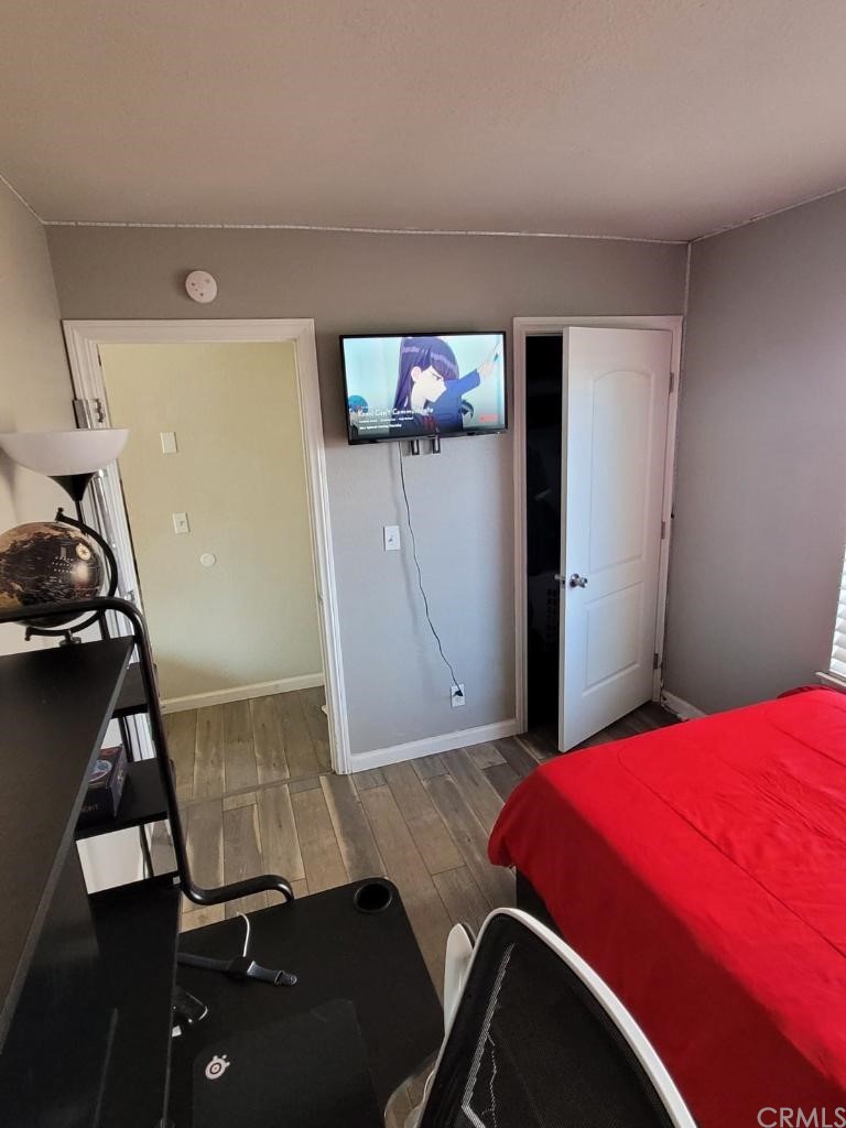 42901 Alexo Drive Lancaster, CA 93536 - Photo 15 of 20 a bedroom with a bed and a mirror