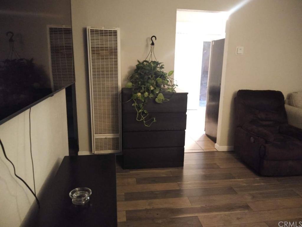 42901 Alexo Drive Lancaster, CA 93536 - Photo 19 of 20 a view of a entryway with wooden floor and furniture