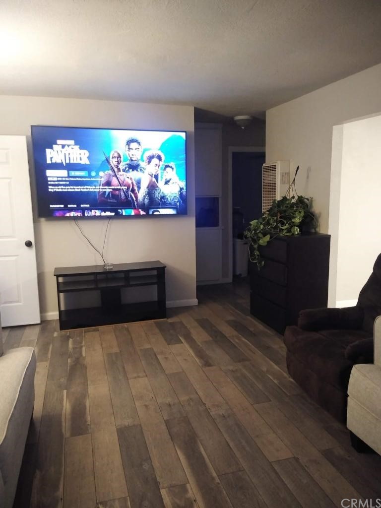 42901 Alexo Drive Lancaster, CA 93536 - Photo 20 of 20 a room with painting on the wall and a potted plant