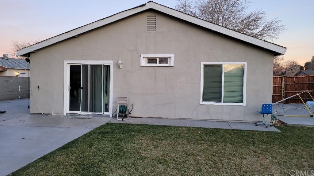 42901 Alexo Drive Lancaster, CA 93536 - Photo 4 of 20 a front view of a house with garden