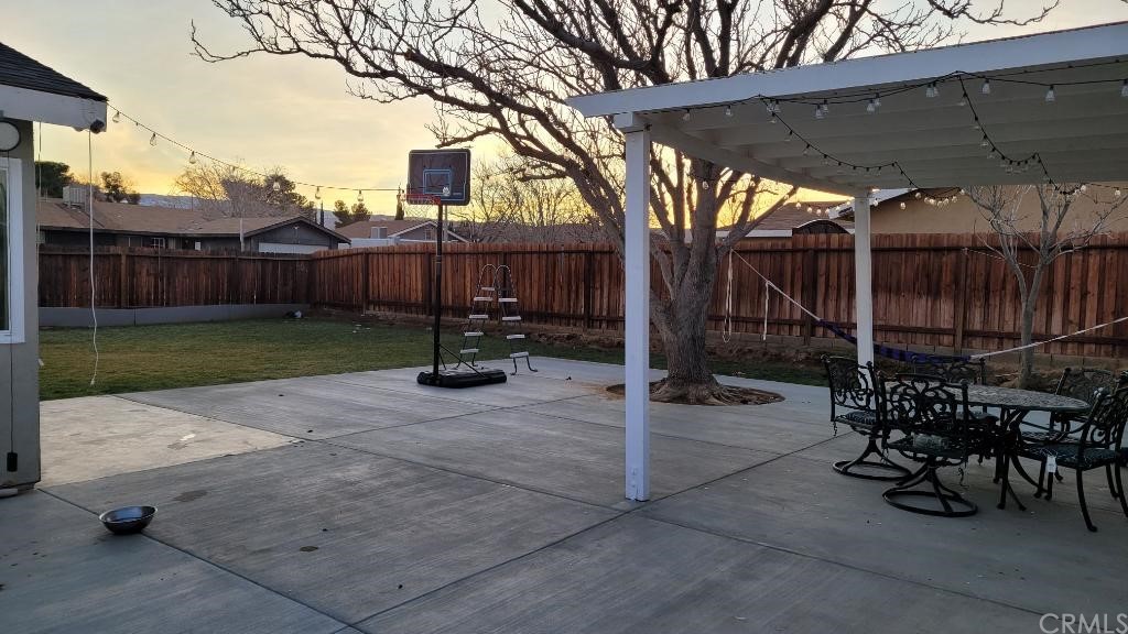 42901 Alexo Drive Lancaster, CA 93536 - Photo 5 of 20 a view of a chairs and table in backyard