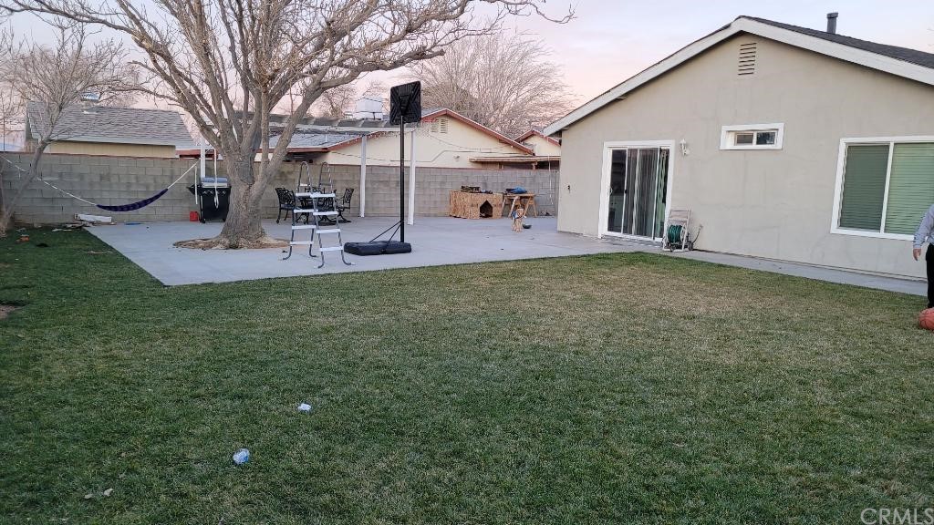 42901 Alexo Drive Lancaster, CA 93536 - Photo 6 of 20 a view of a house with backyard and a tree