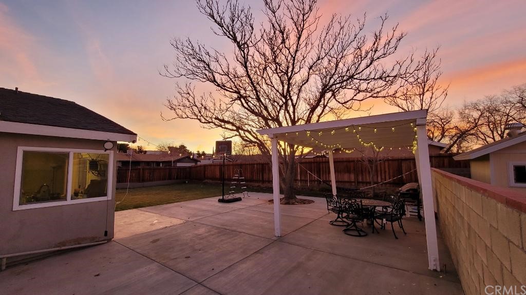 42901 Alexo Drive Lancaster, CA 93536 - Photo 7 of 20 a view of outdoor space with seating area and trees around
