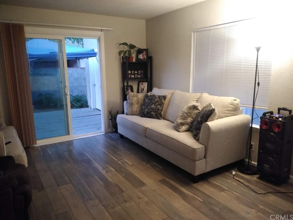42901 Alexo Drive Lancaster, CA 93536 - Photo 8 of 20 a living room with furniture and a wooden floor