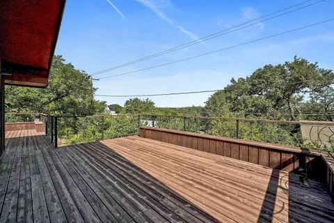 a view of balcony with wooden floor and outdoor space