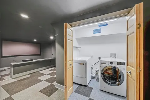 a view of a hallway with washer and dryer