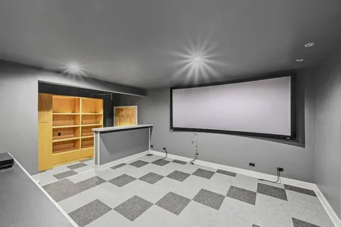 a view of an empty room with window and stairs