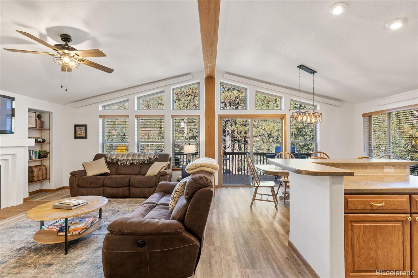 76 Wheel Haven Road Idaho Springs, CO 80452 - Photo 12 of 50 a living room with furniture and a large window