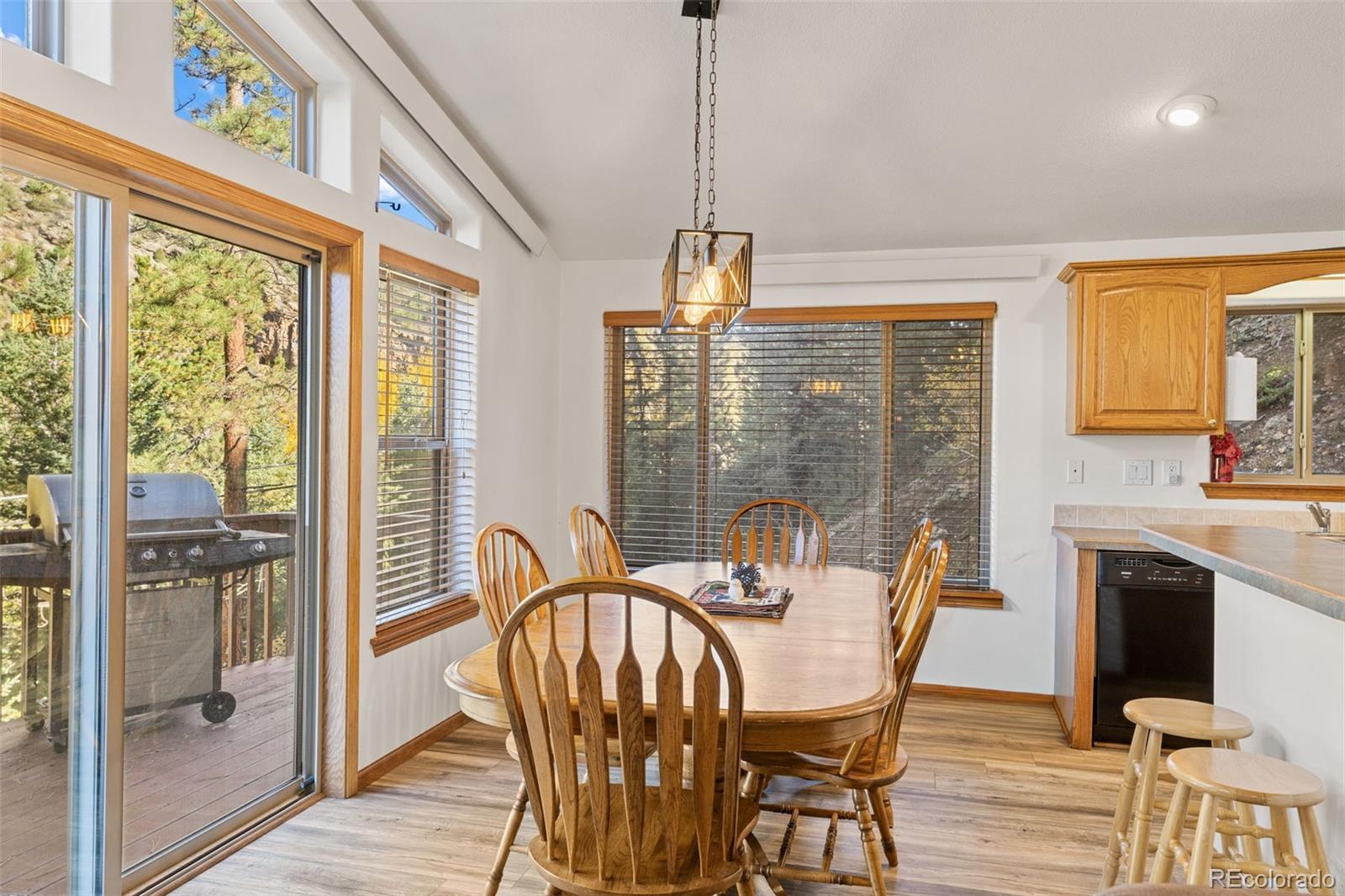 76 Wheel Haven Road Idaho Springs, CO 80452 - Photo 13 of 50 a view of a dining room with furniture window and outside view