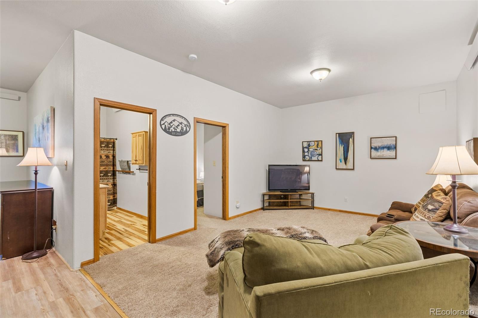 76 Wheel Haven Road Idaho Springs, CO 80452 - Photo 35 of 50 a bed room with a bed and a tv