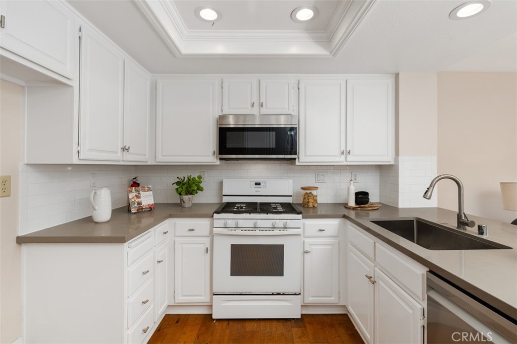 25721 Shell Drive Dana Point, CA 92629 - Photo 15 of 41 a kitchen with cabinets appliances a sink and a counter top space