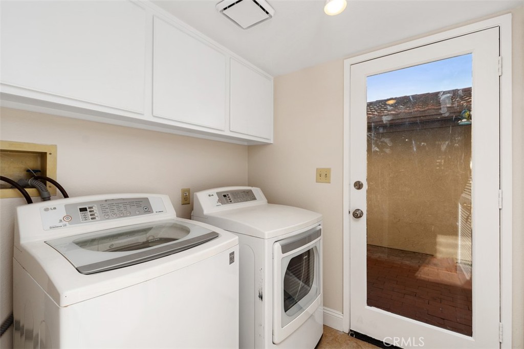 25721 Shell Drive Dana Point, CA 92629 - Photo 18 of 41 a utility room with dryer and washer