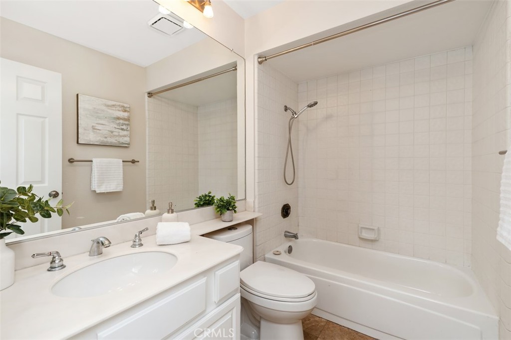 25721 Shell Drive Dana Point, CA 92629 - Photo 21 of 41 a bathroom with a bathtub shower sink mirror vanity and toilet