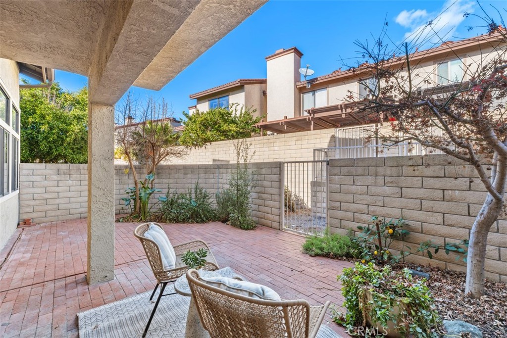 25721 Shell Drive Dana Point, CA 92629 - Photo 26 of 41 a view of a patio with table and chairs and potted plants
