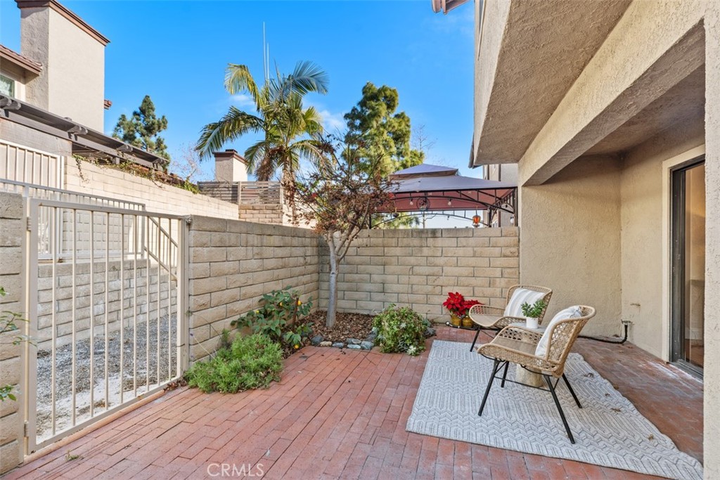 25721 Shell Drive Dana Point, CA 92629 - Photo 29 of 41 a patio with table and chairs and potted plants