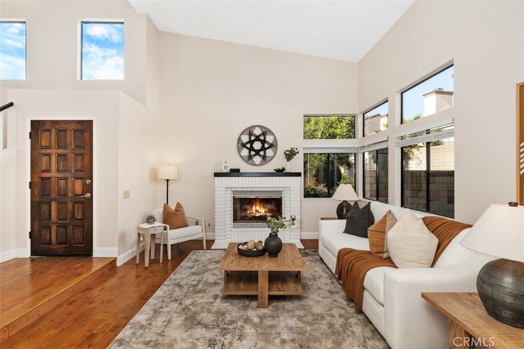 25721 Shell Drive Dana Point, CA 92629 - Photo 4 of 41 a living room with furniture a fireplace and a large window