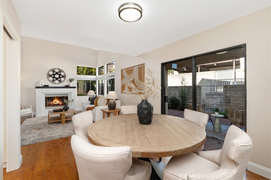 25721 Shell Drive Dana Point, CA 92629 - Photo 9 of 41 a dining room with furniture a fireplace and wooden floor