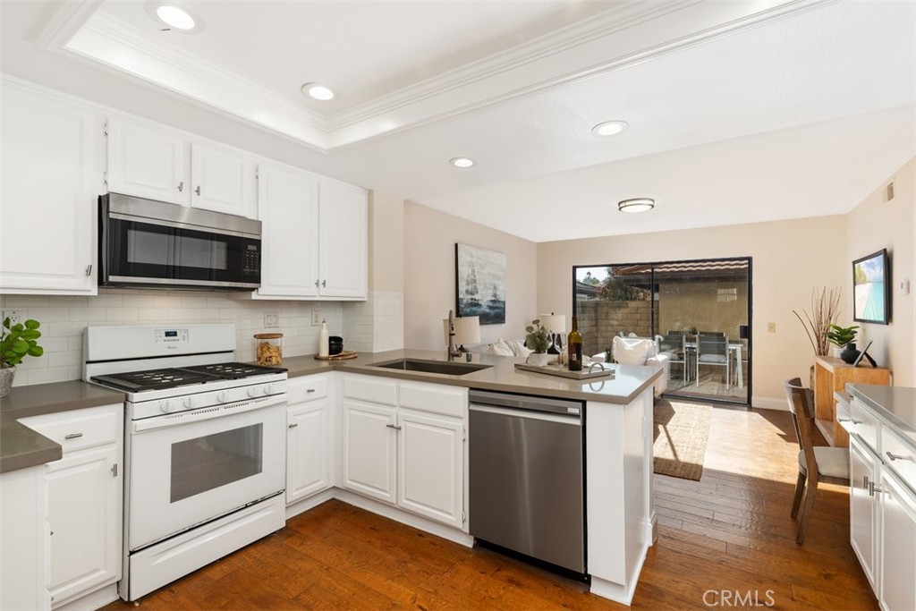 25721 Shell Drive Dana Point, CA 92629 - Photo 10 of 41 a kitchen with a sink stove and cabinets