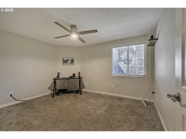 a room with workbench and window