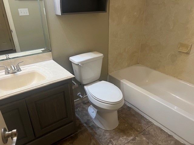 1904 Kelly Lane Kingsville, TX 78363 - Photo 13 of 21 a white toilet sitting next to a bathroom sink