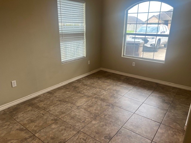 1904 Kelly Lane Kingsville, TX 78363 - Photo 6 of 21 an empty room with windows