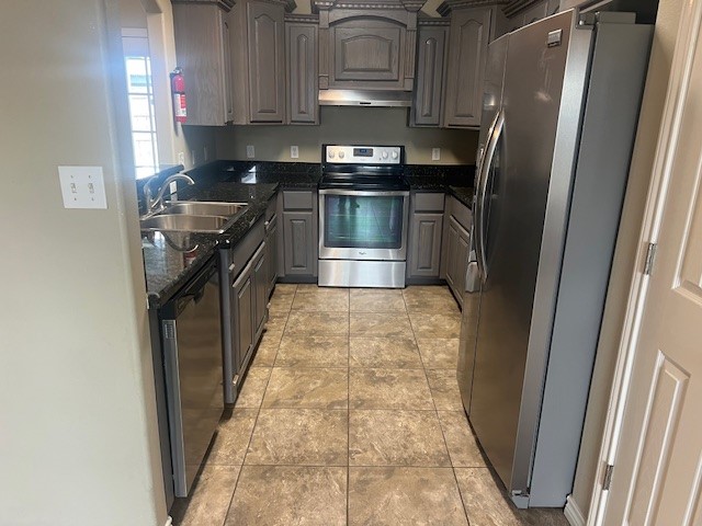1904 Kelly Lane Kingsville, TX 78363 - Photo 7 of 21 a kitchen with stainless steel appliances granite countertop a stove a refrigerator and a sink