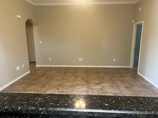 a view of a hallway with a wooden door